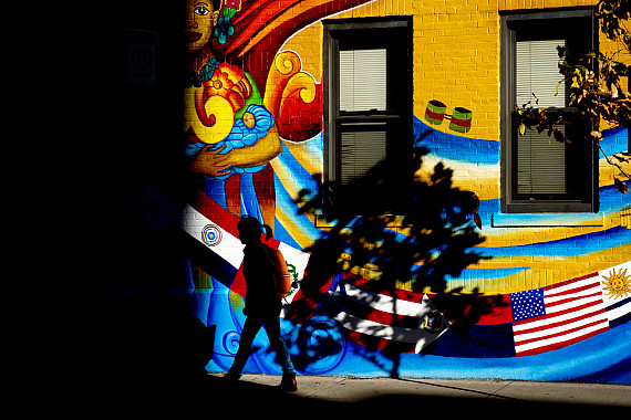 A student walk past the newly painted mural on the Latino Student Cultural Center on Nov. 7, 2016. Photo by Adam Glanzman/Northeastern Un...